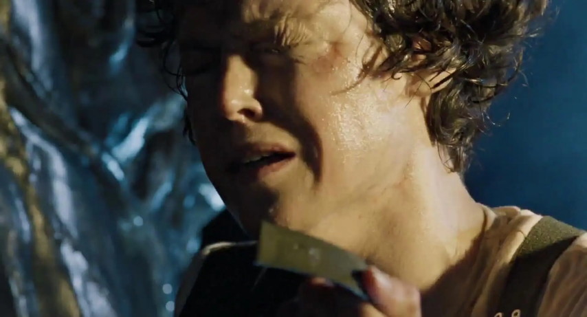 An image from the movie "Aliens". Ripley, holding Newt's discarded tracking bracelet, looks distraught.