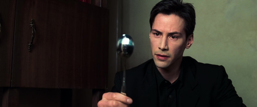 An image from the movie "The Matrix". Neo ponders a spoon.